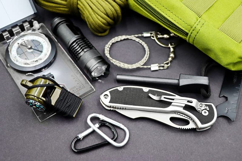 A life jacket and a whistle on a wooden surface