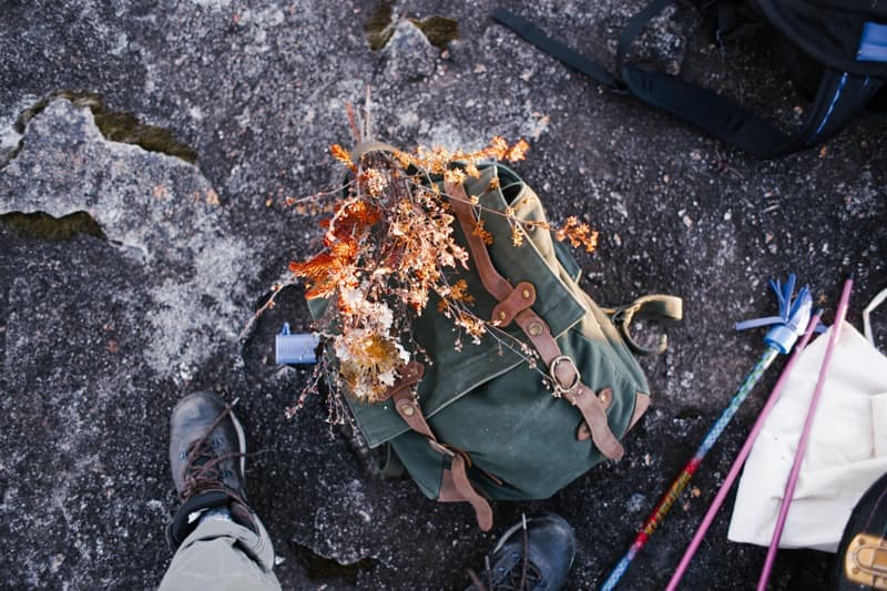 A roll-top waterproof dry bag with outdoor gear