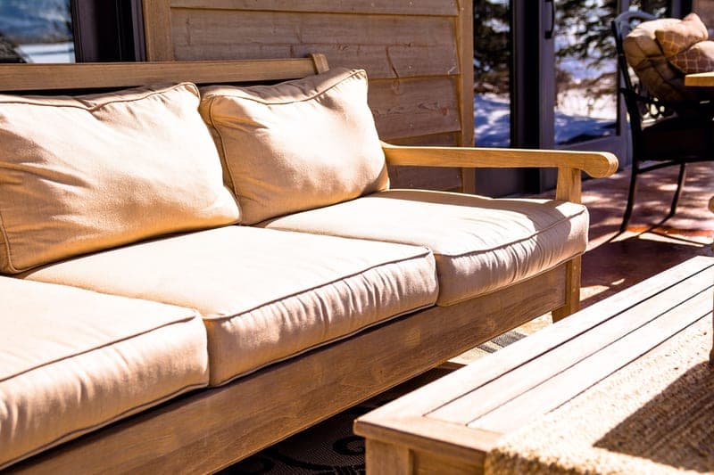 A cushioned outdoor seat pad