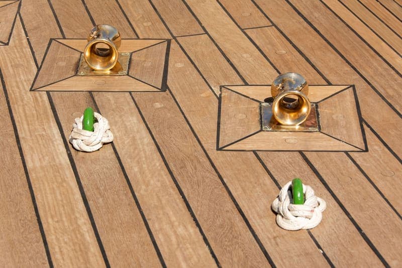 Close-up of deck hardware and rope fittings on a boat