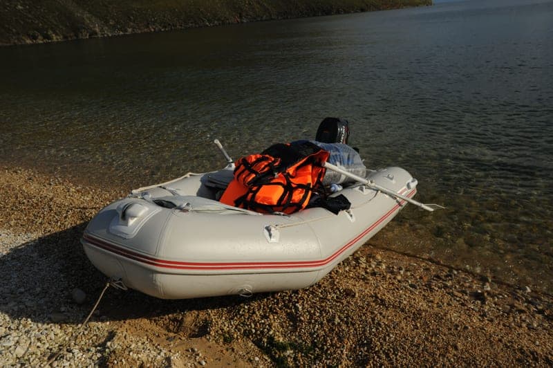 An inflatable belt-style life vest on a boat