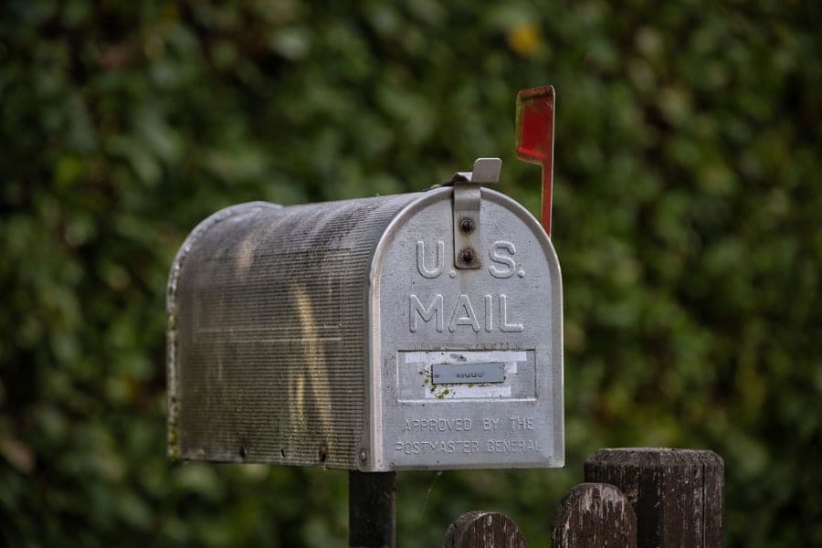A mailbox beside a lake shore