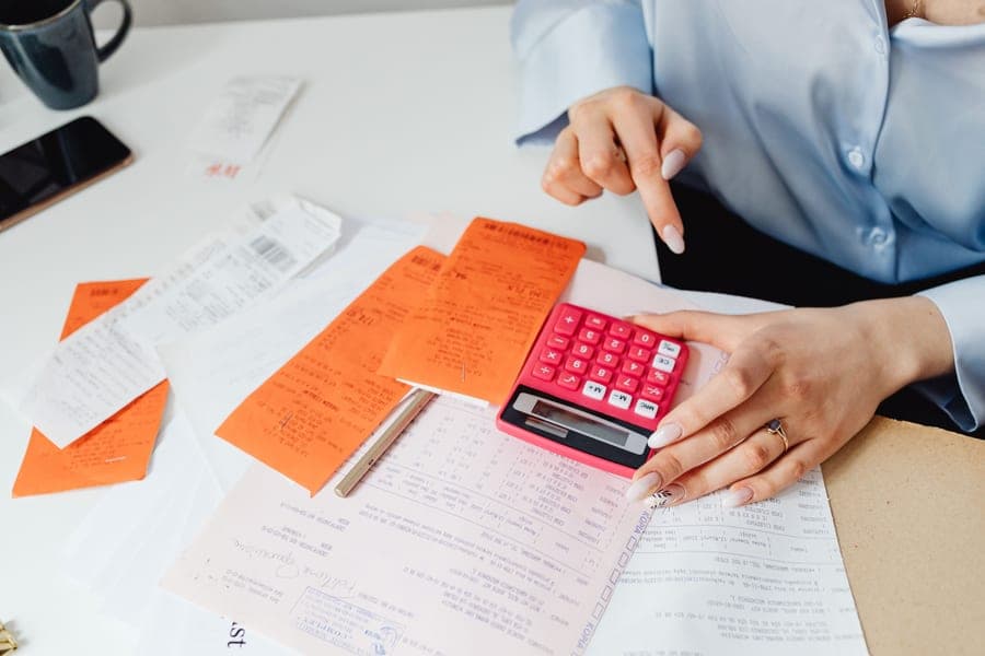 A receipt and a calculator on a desk
